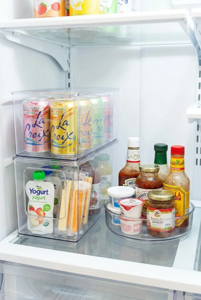 Clear fridge bins and a turntable organizing food by chart zone